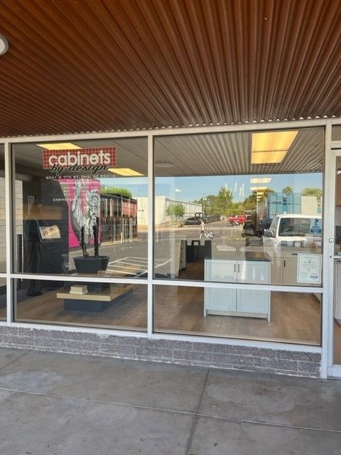 A store front with a sign that says cabinets