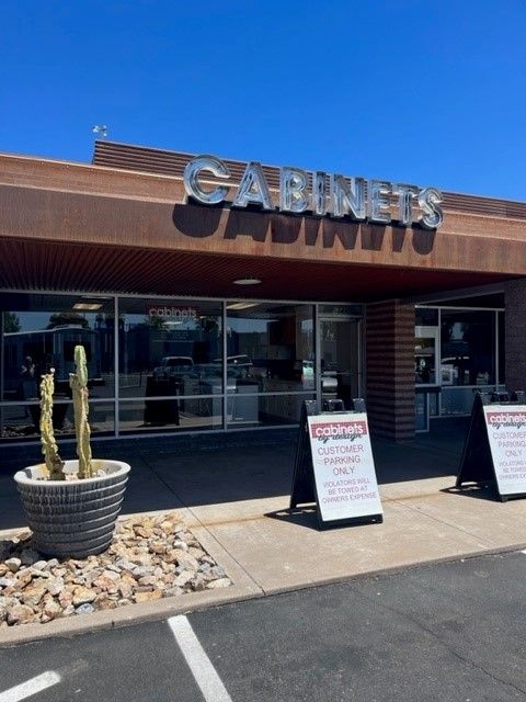 A cabinets store with a cactus in front of it