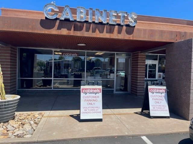 A cabinets store with a sign that says customer parking only