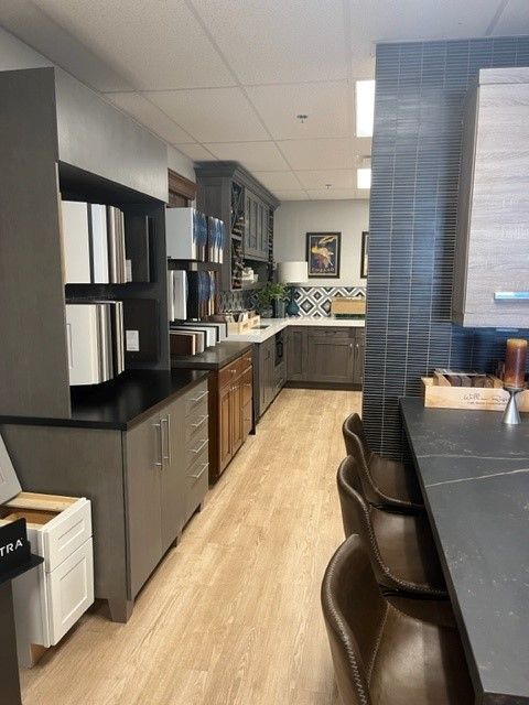 A kitchen with a lot of cabinets and a table
