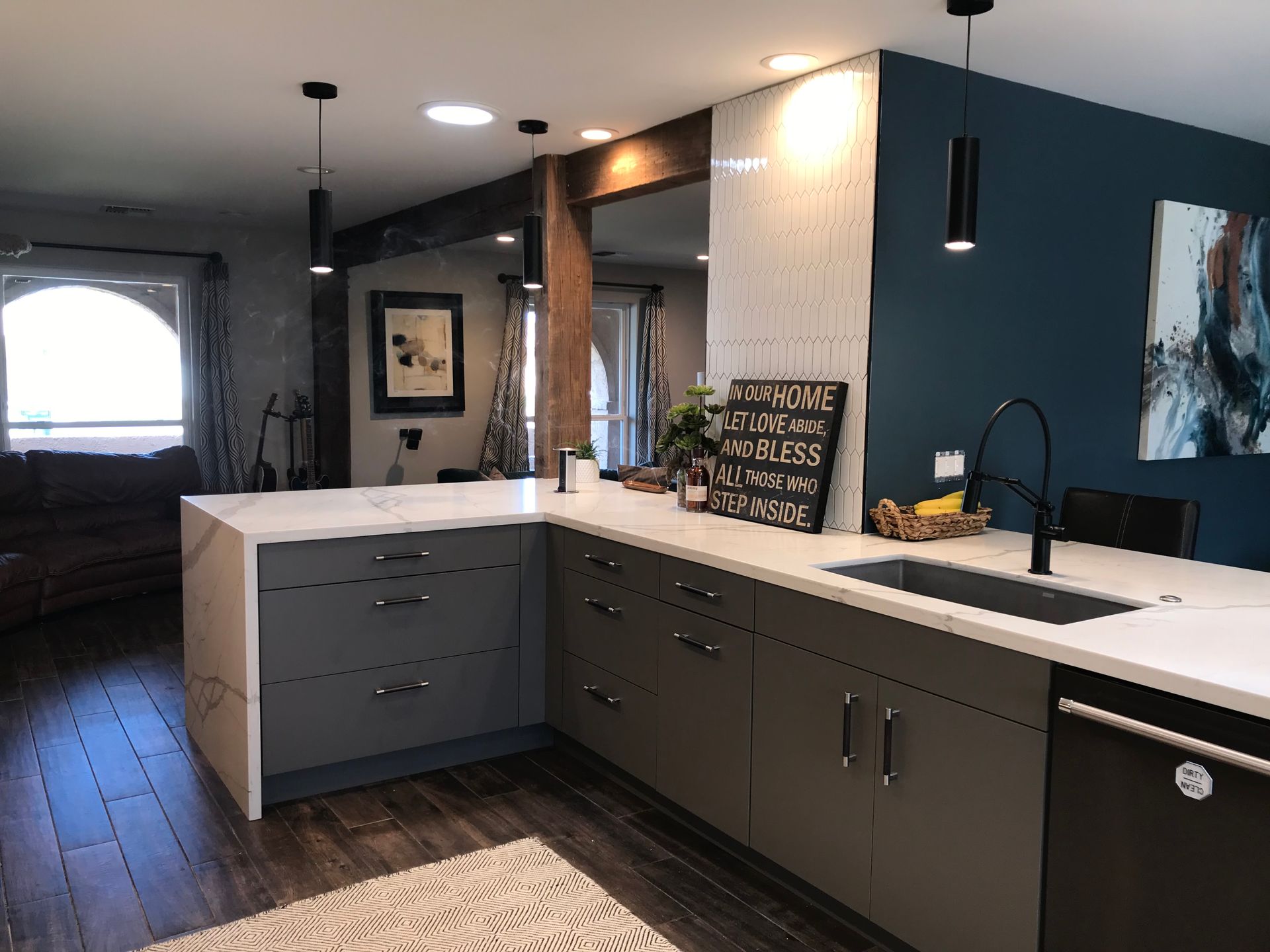 A kitchen with a large island and a sink