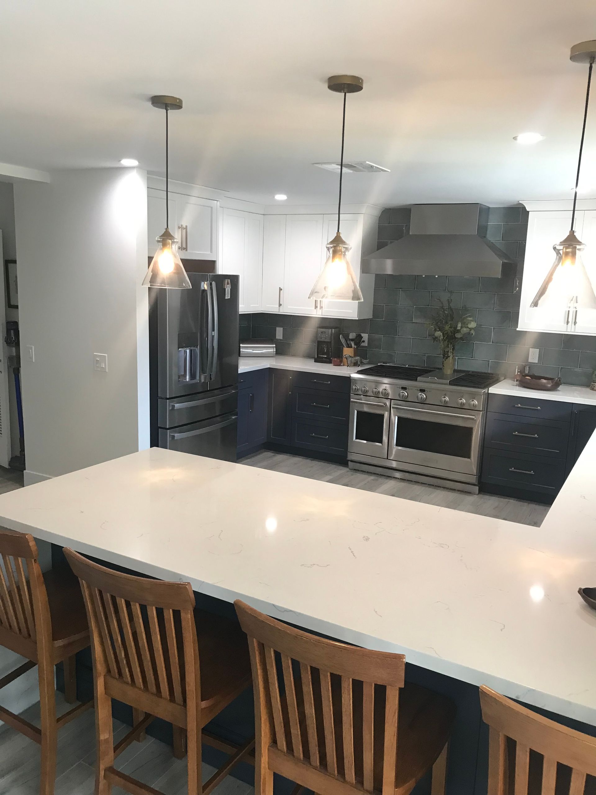 A kitchen with a table and chairs in it
