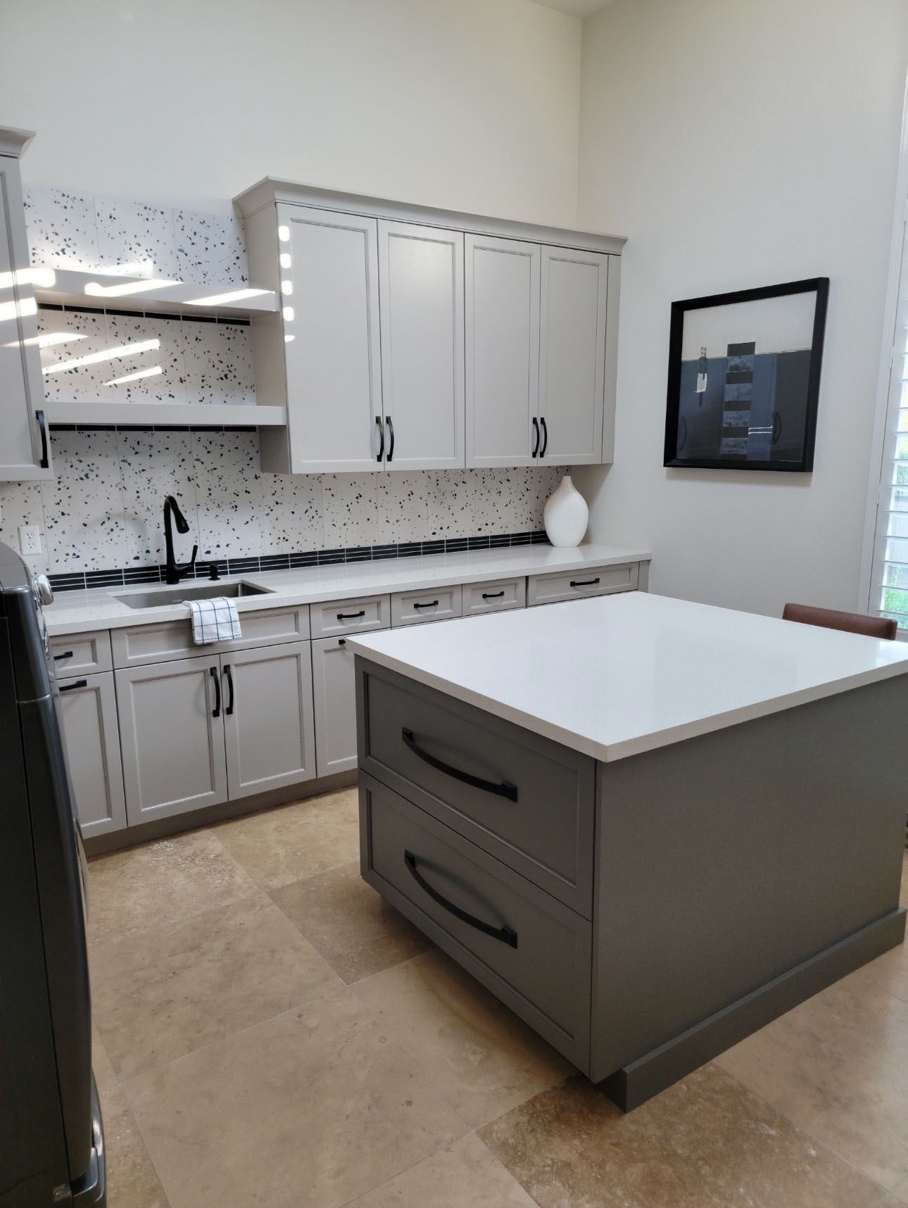 There is a large island in the middle of the kitchen.