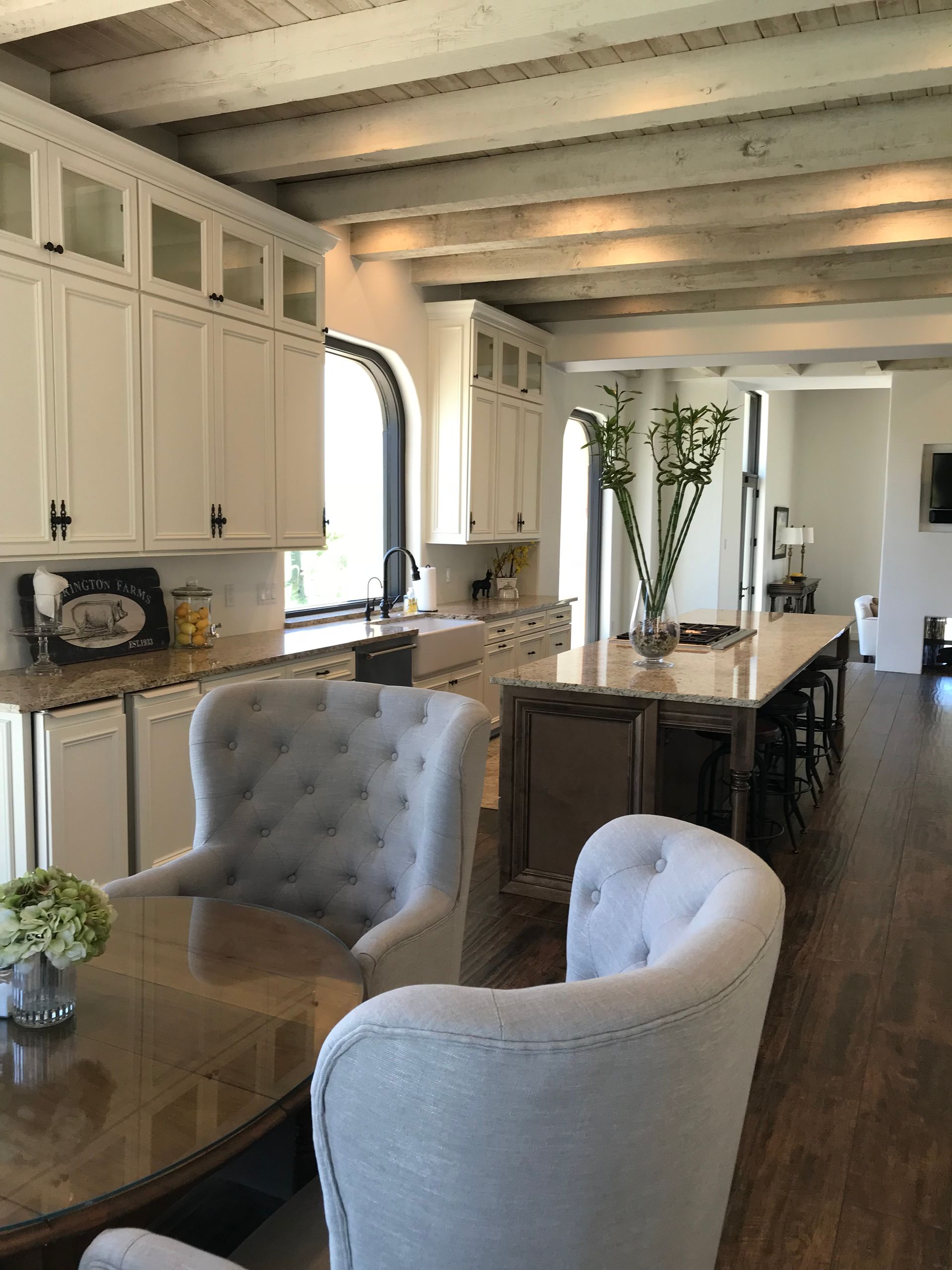 A kitchen with a table and chairs in it