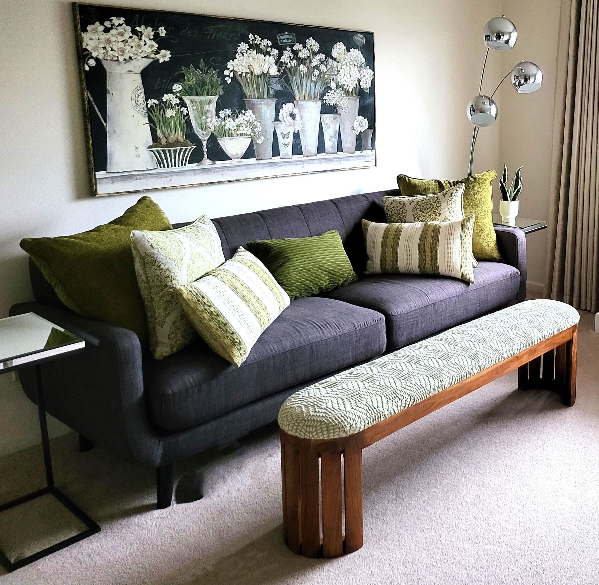 A living room with a couch and a bench