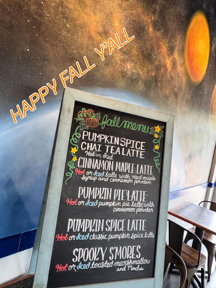 Fall menu chalkboard with pumpkin spice lattes and spooky s’mores