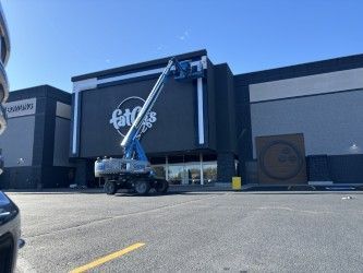 A large building with a crane on top of it.