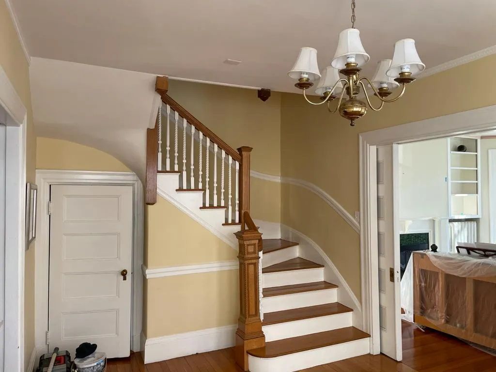 a staircase in a house with chandelier