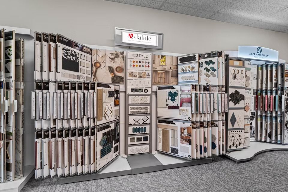 Flooring showroom display with rows of sample panels and a central information board.