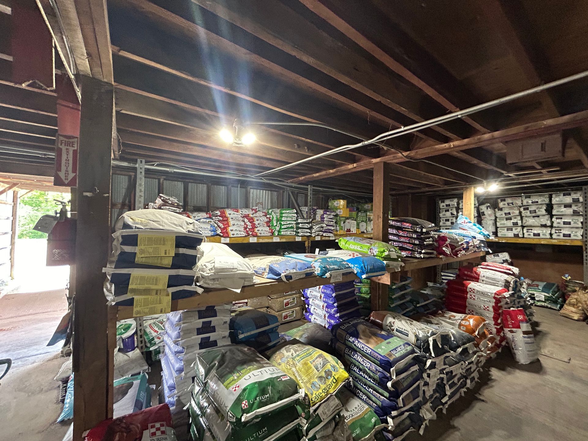 A warehouse filled with lots of bags of fertilizer