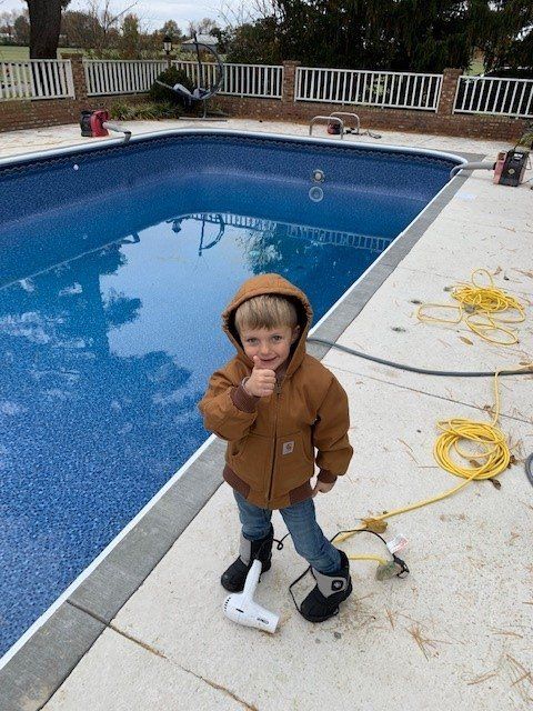 Little boy beside the swimming pool