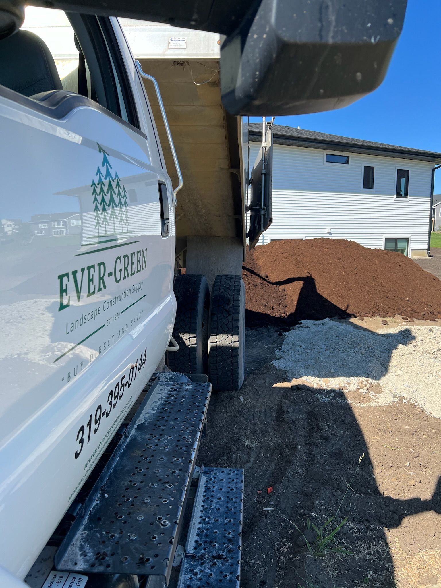 A white landscaping truck with 