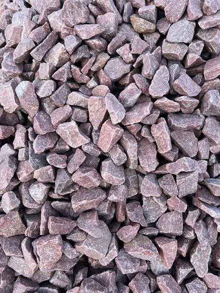 Pile of reddish-purple gravel, with irregular shapes and a coarse texture.
