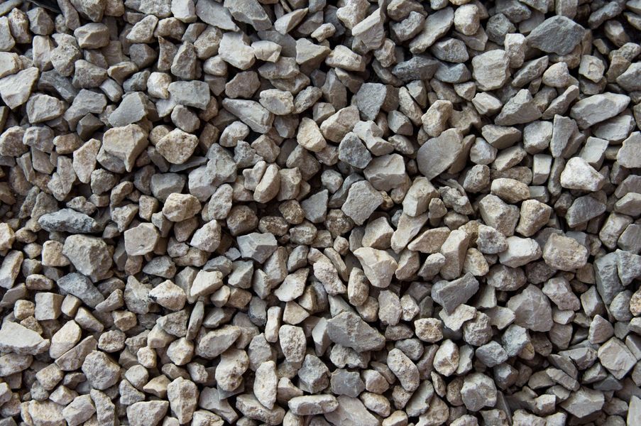 Crushed gravel, varying shades of gray and tan, tightly packed.
