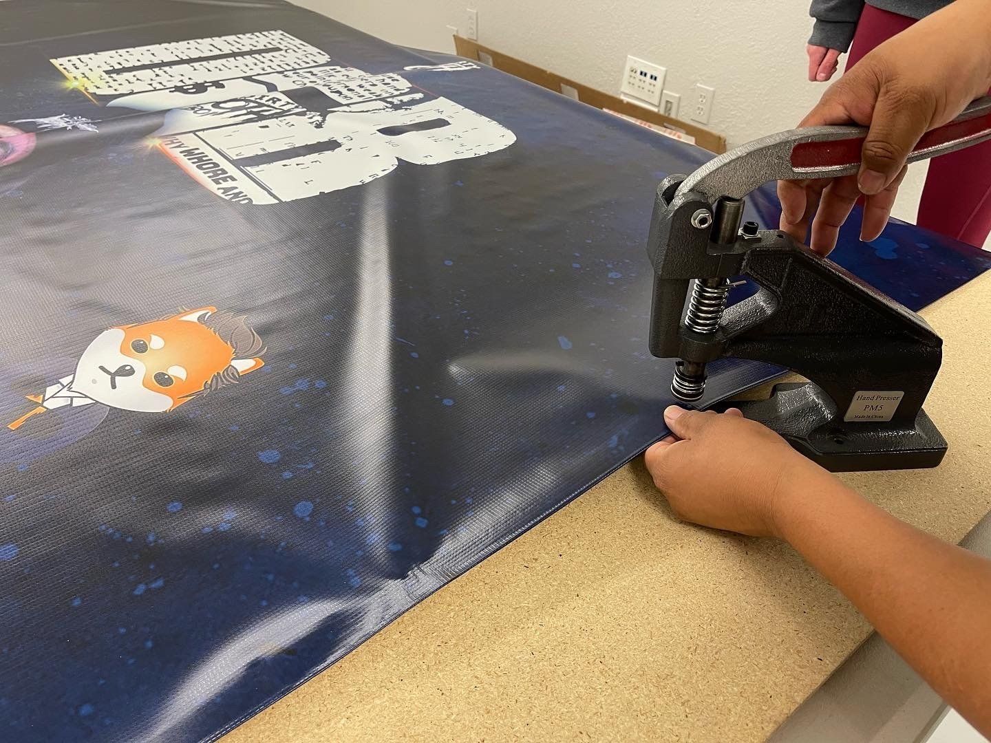 punching whole in a banner