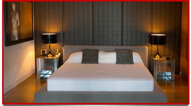 Mattress in a bed with white pillow and lamps