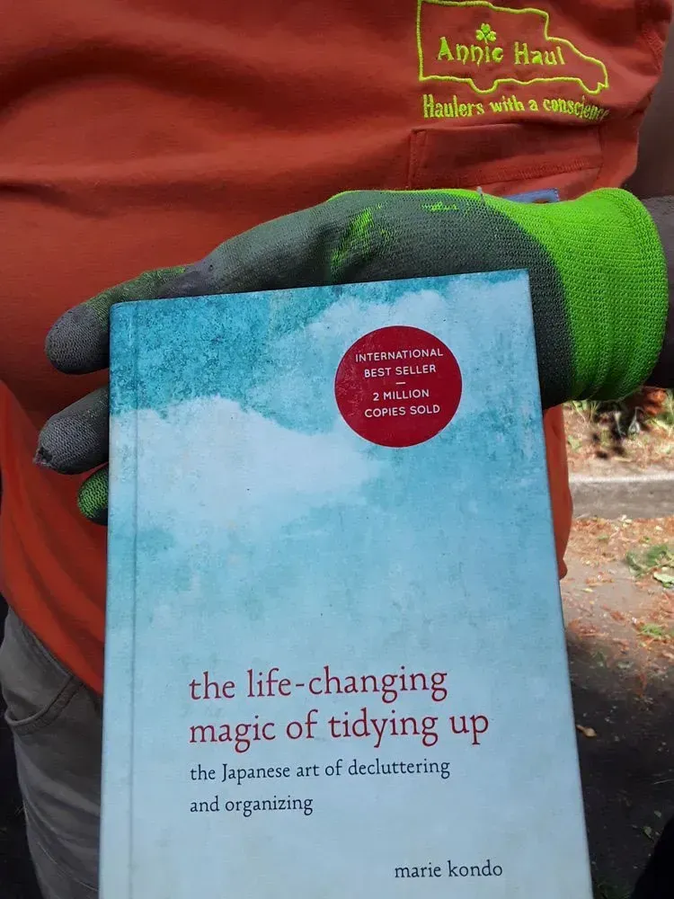 Person holding a copy of 