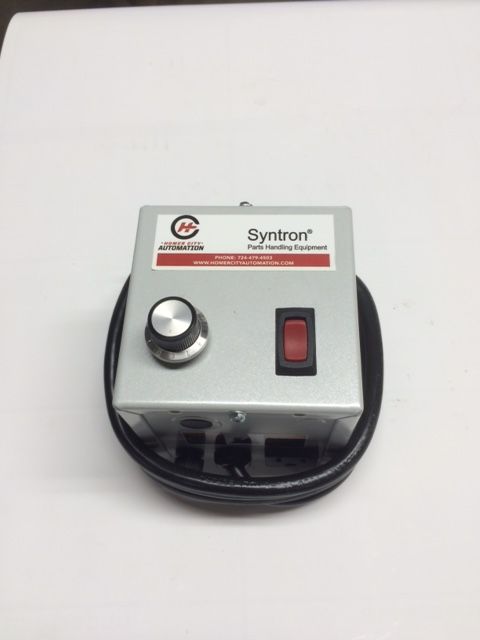Small gray Syntron control box with a knob and red rocker switch, coiled black cable attached