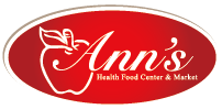 Ann's Health Food Center & Market logo, featuring white apple outline and cursive text on a red oval.
