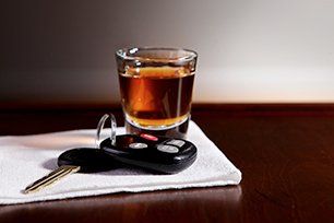 Car key and liquor drink