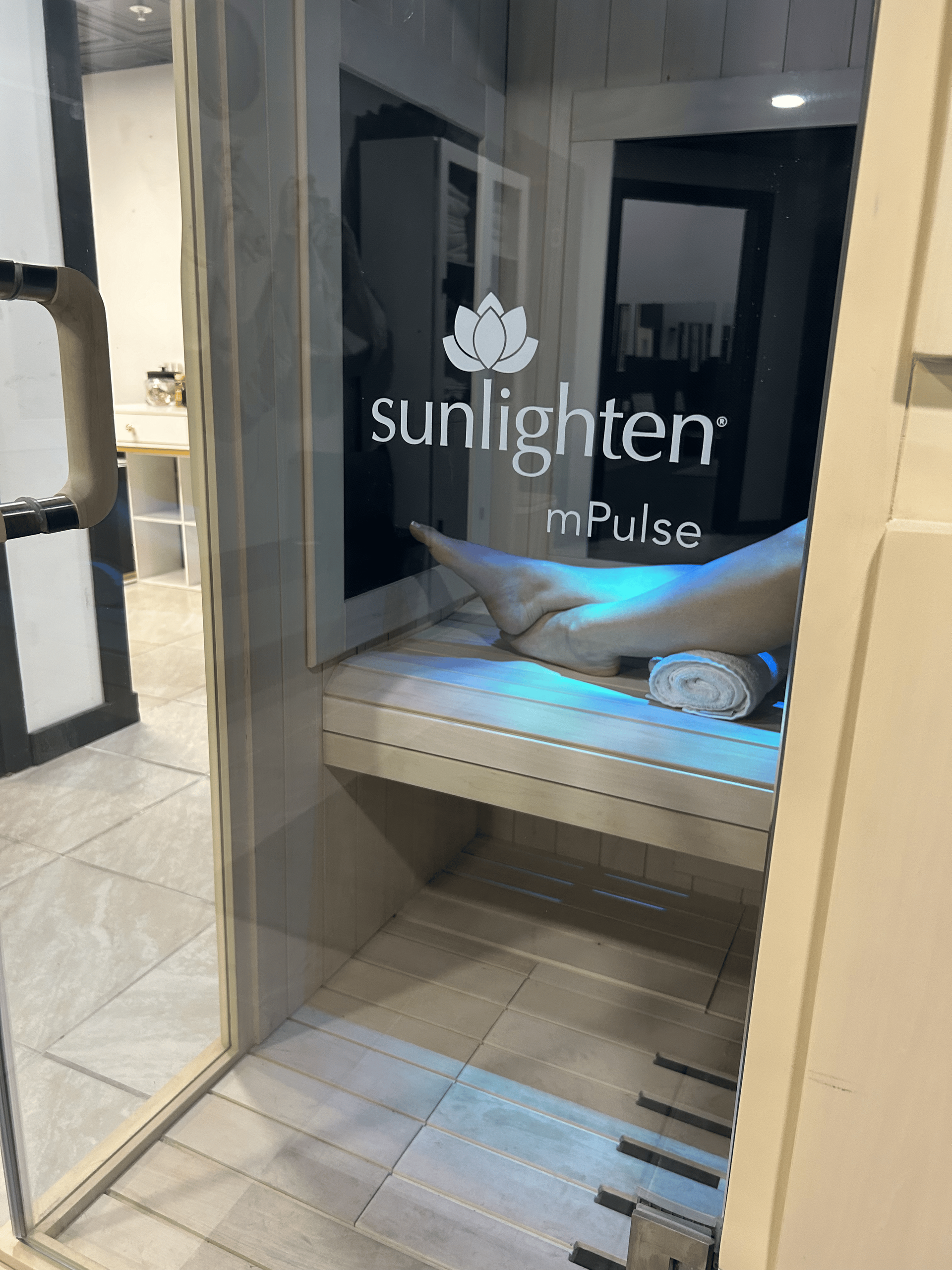 A person is sitting in a sunlight pulse sauna.
