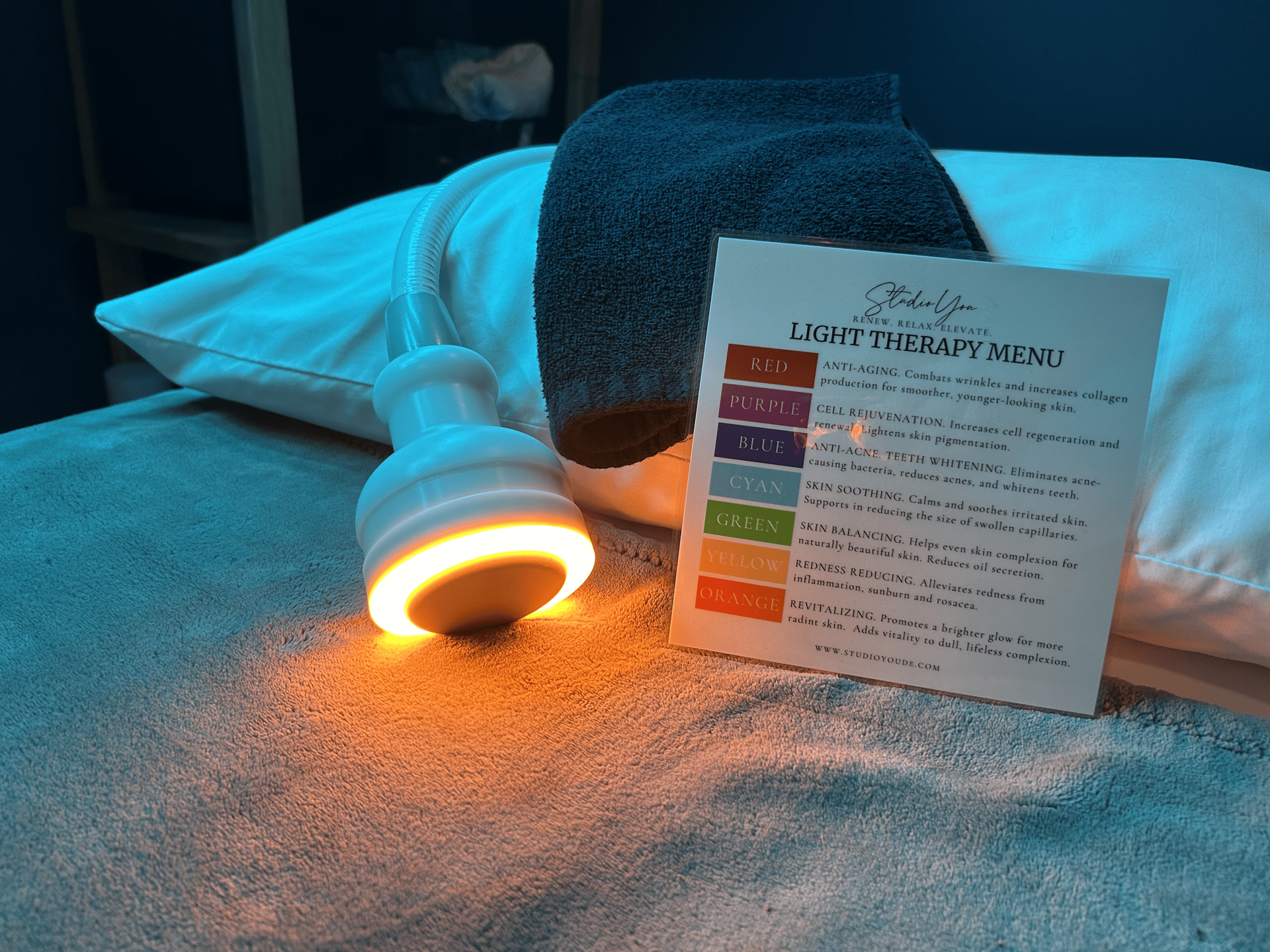 A person is laying on a bed with a sign that says ' sally ' on it