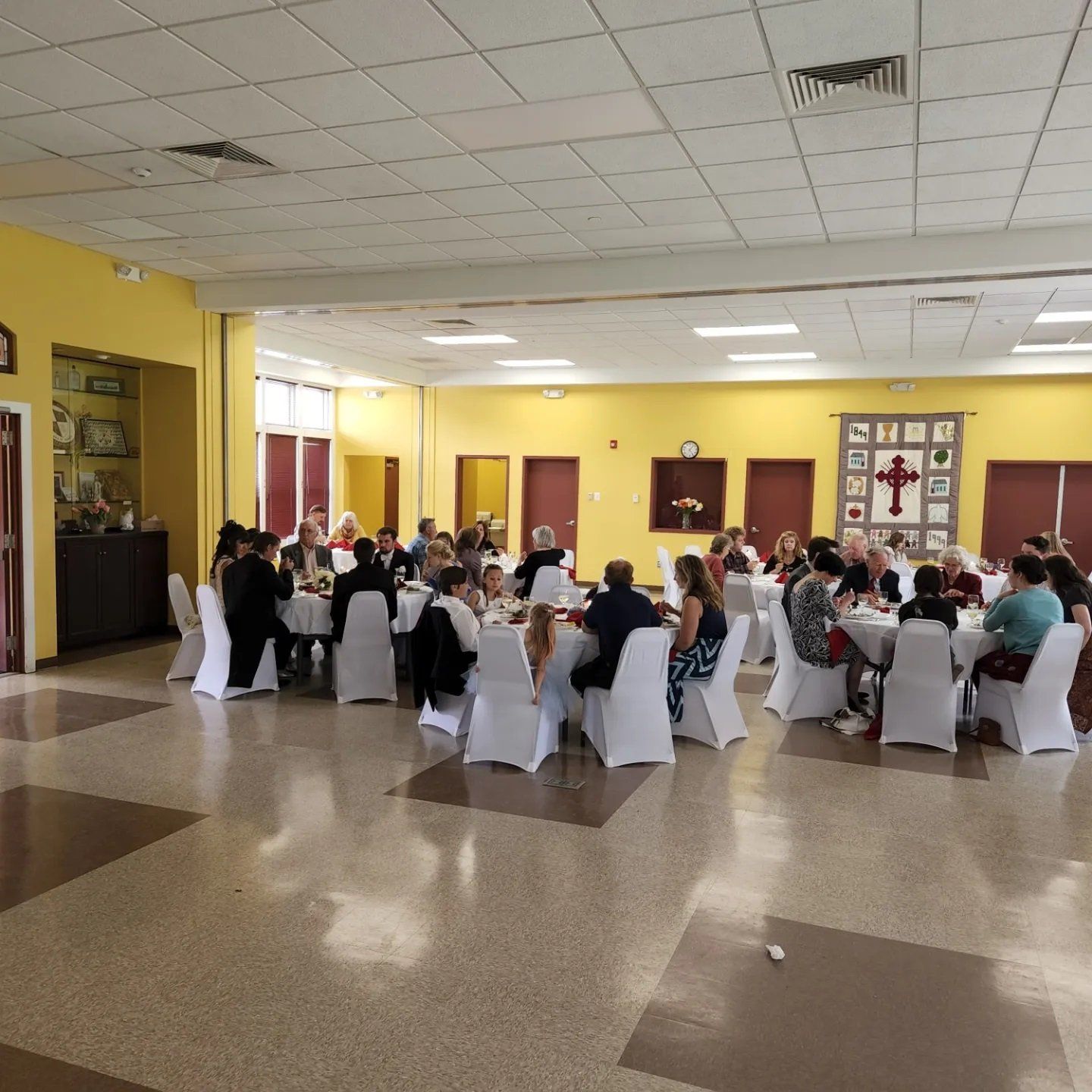People eating at a small reception