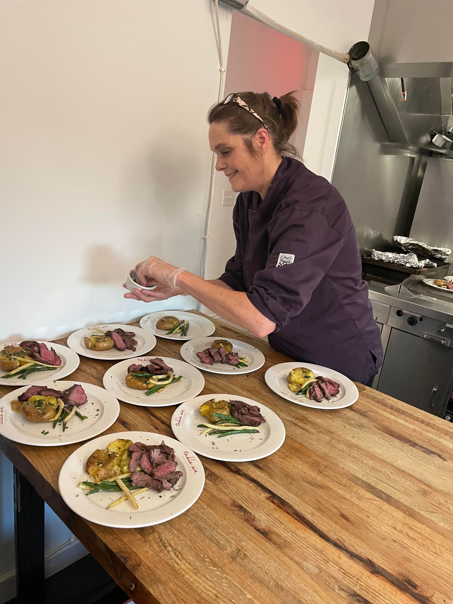 lady putting food on plates