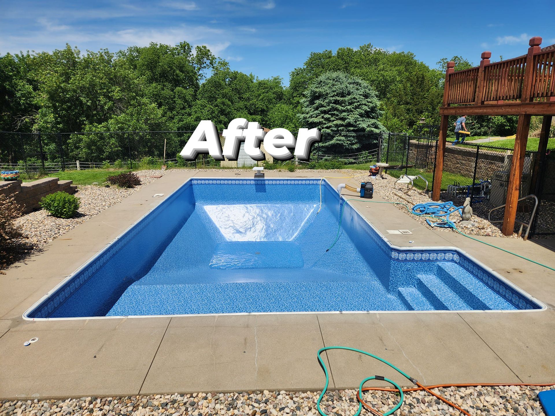 A picture of a swimming pool after being remodeled.