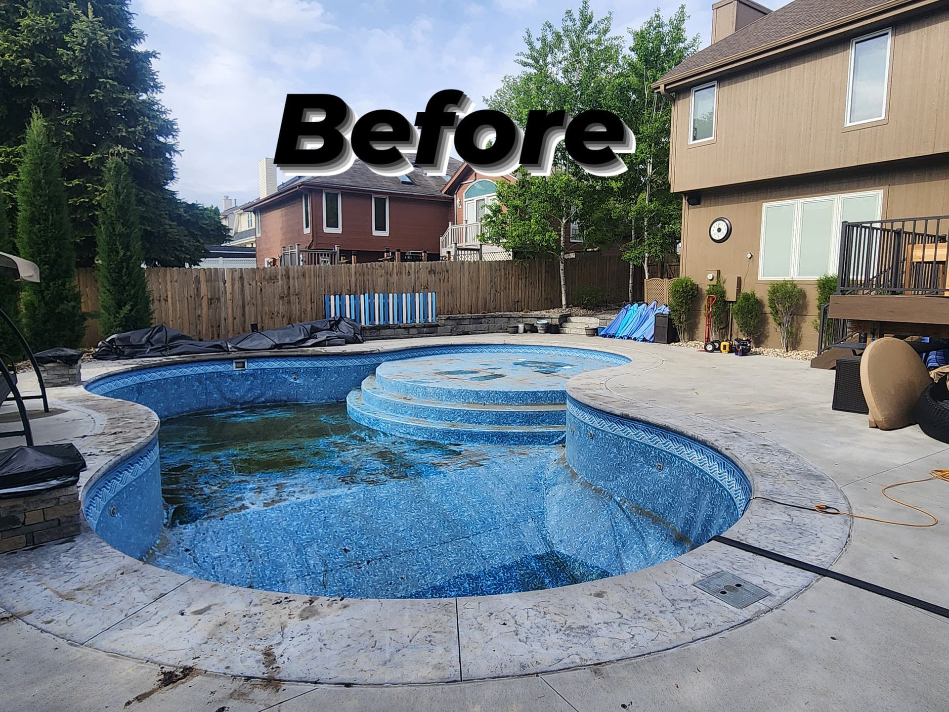 A picture of a swimming pool before being remodeled