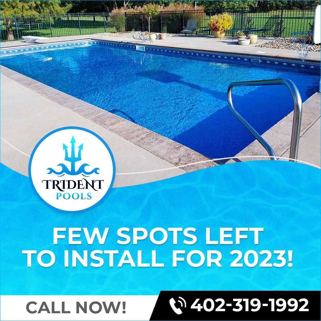 An advertisement for trident pools that says few spots left to install for 2023