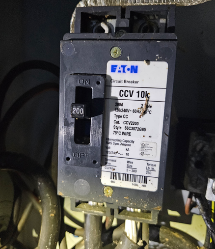 Close-up of an Eaton CCV 10k circuit breaker with a 200 amp switch lever.