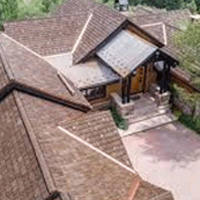 An aerial view of a house with a Cedur roofing.