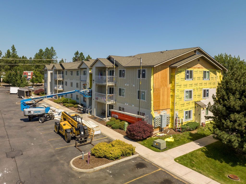 An aerial view of a large apartment building under construction