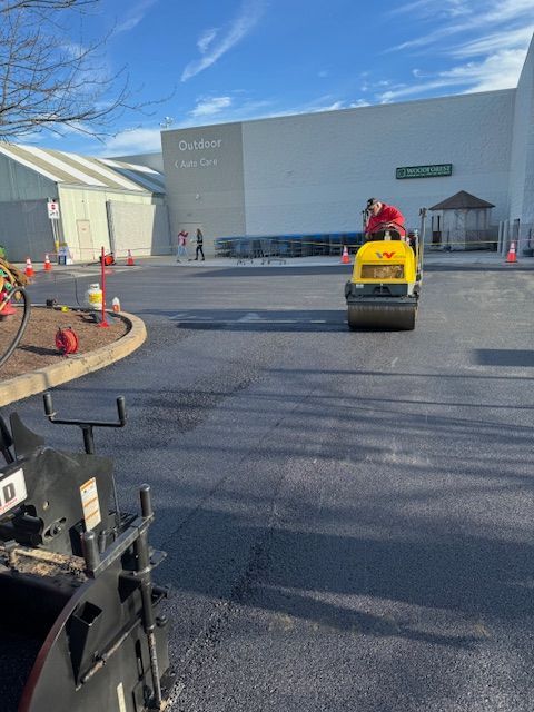 a man is riding a yellow roller in a parking lot