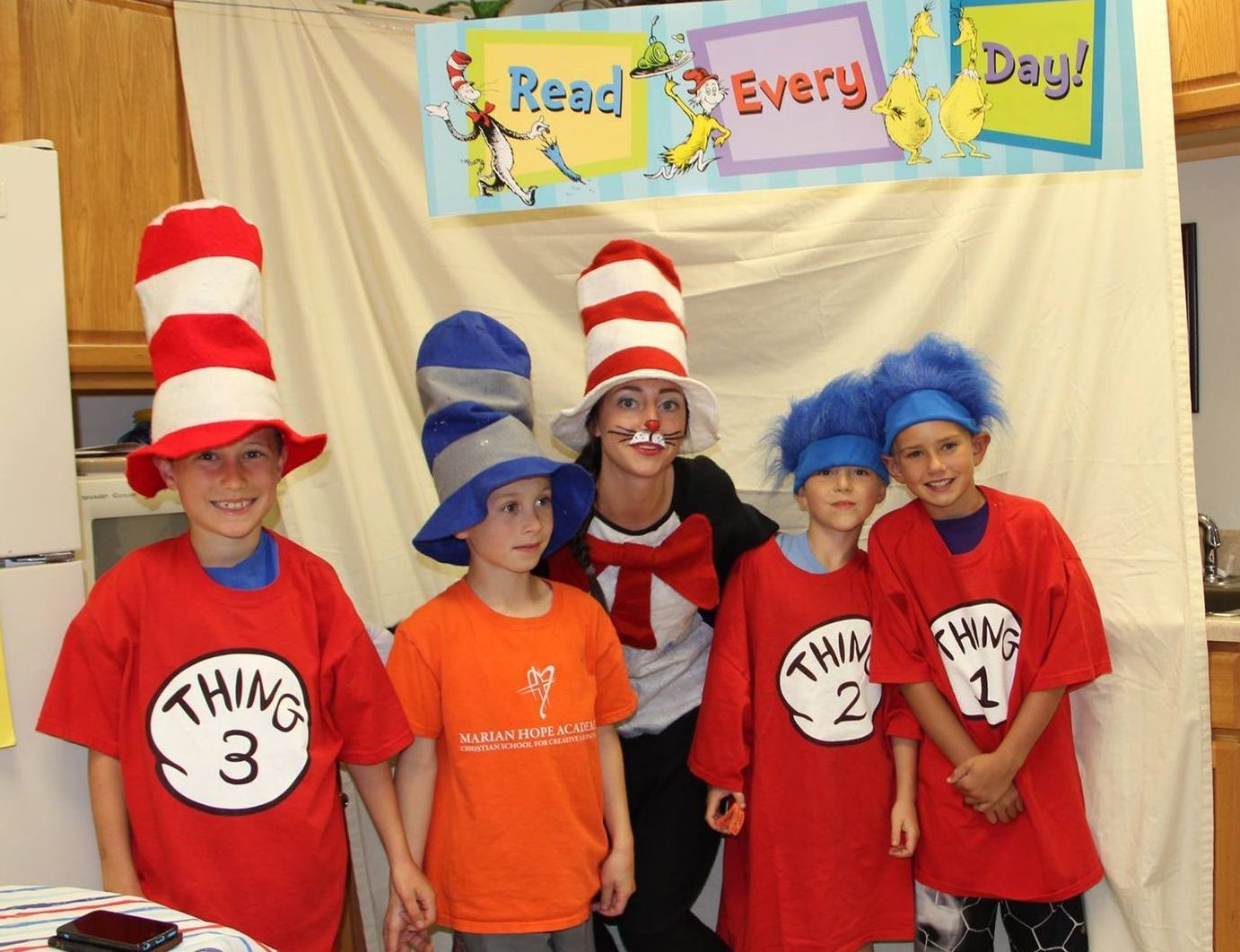 A group of children are dressed up as dr. seuss characters