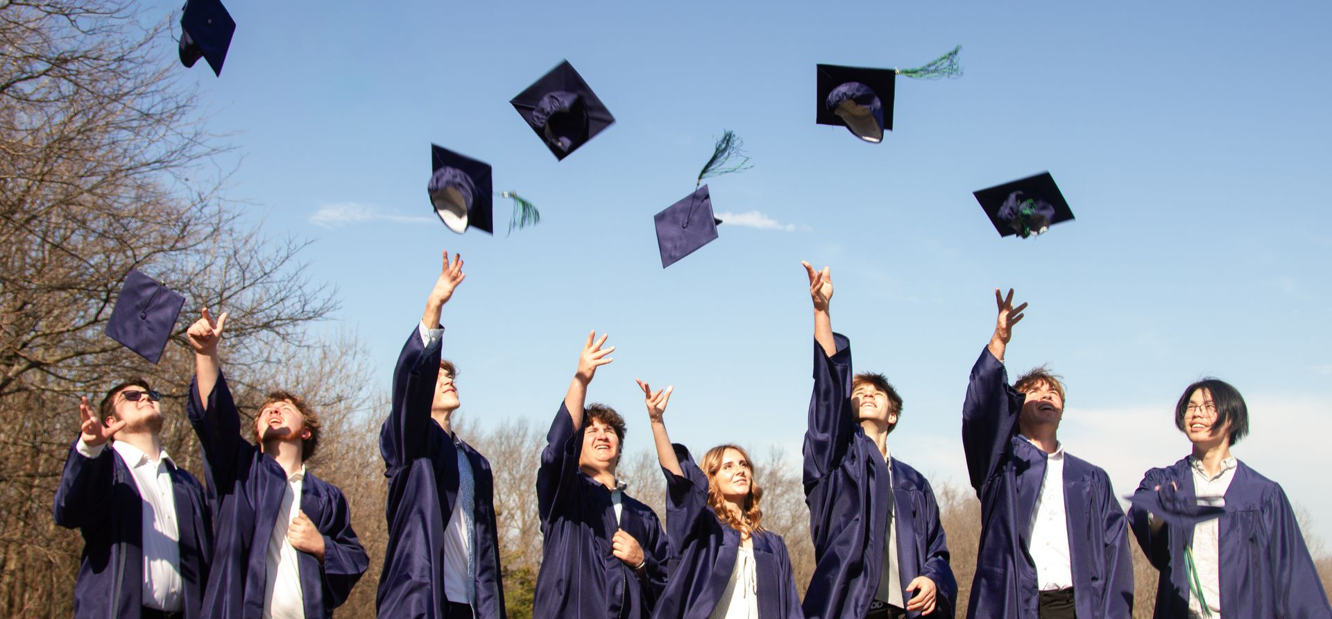 A group of young people are posing for a picture together.