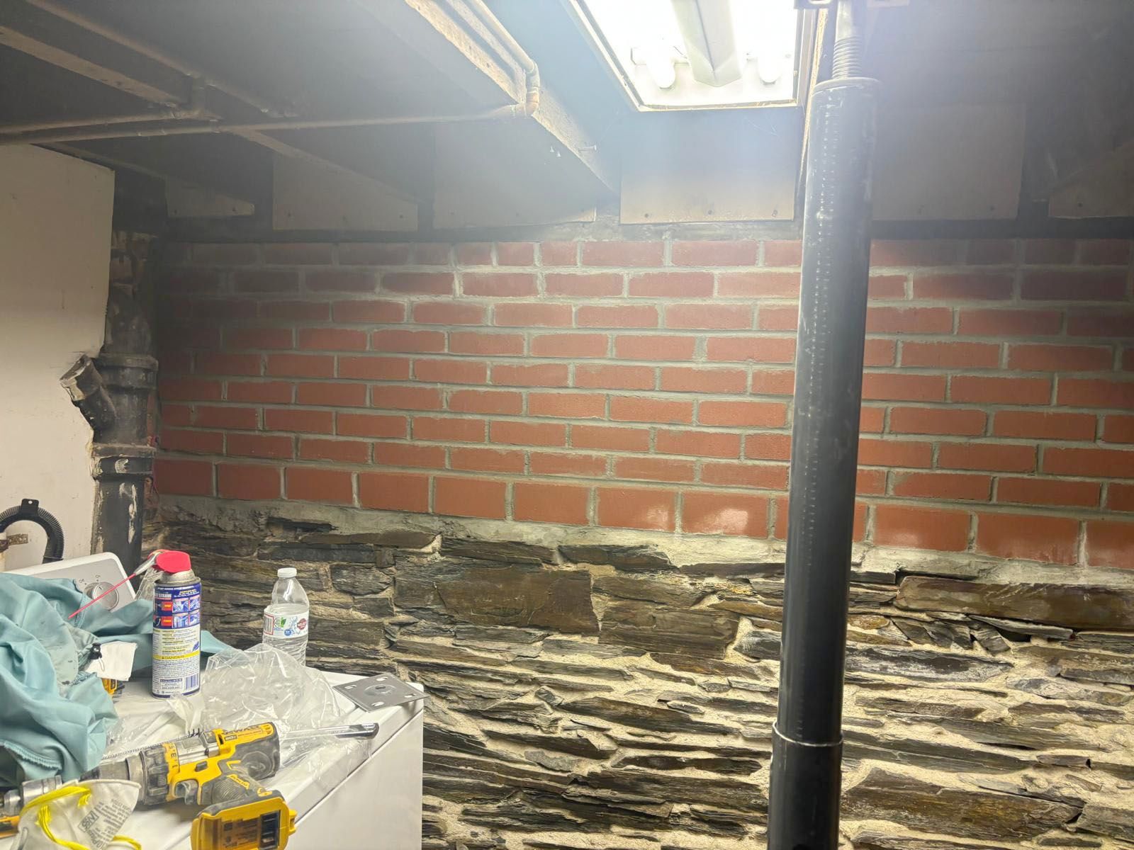 Basement wall: brick above, stone below