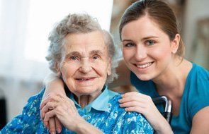 An elderly woman with a nurse