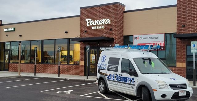 Panera Bread restaurant with a service van parked in front.