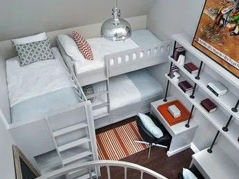 Small bedroom with three beds: bunk bed, and a single bed. Desk with shelves and a spiral staircase.