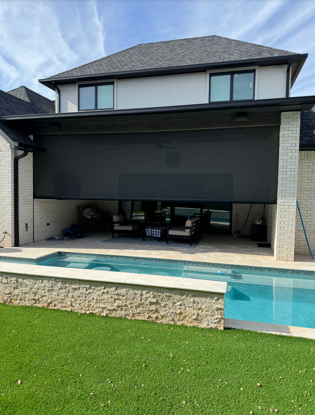 Motorized patio screen halfway open