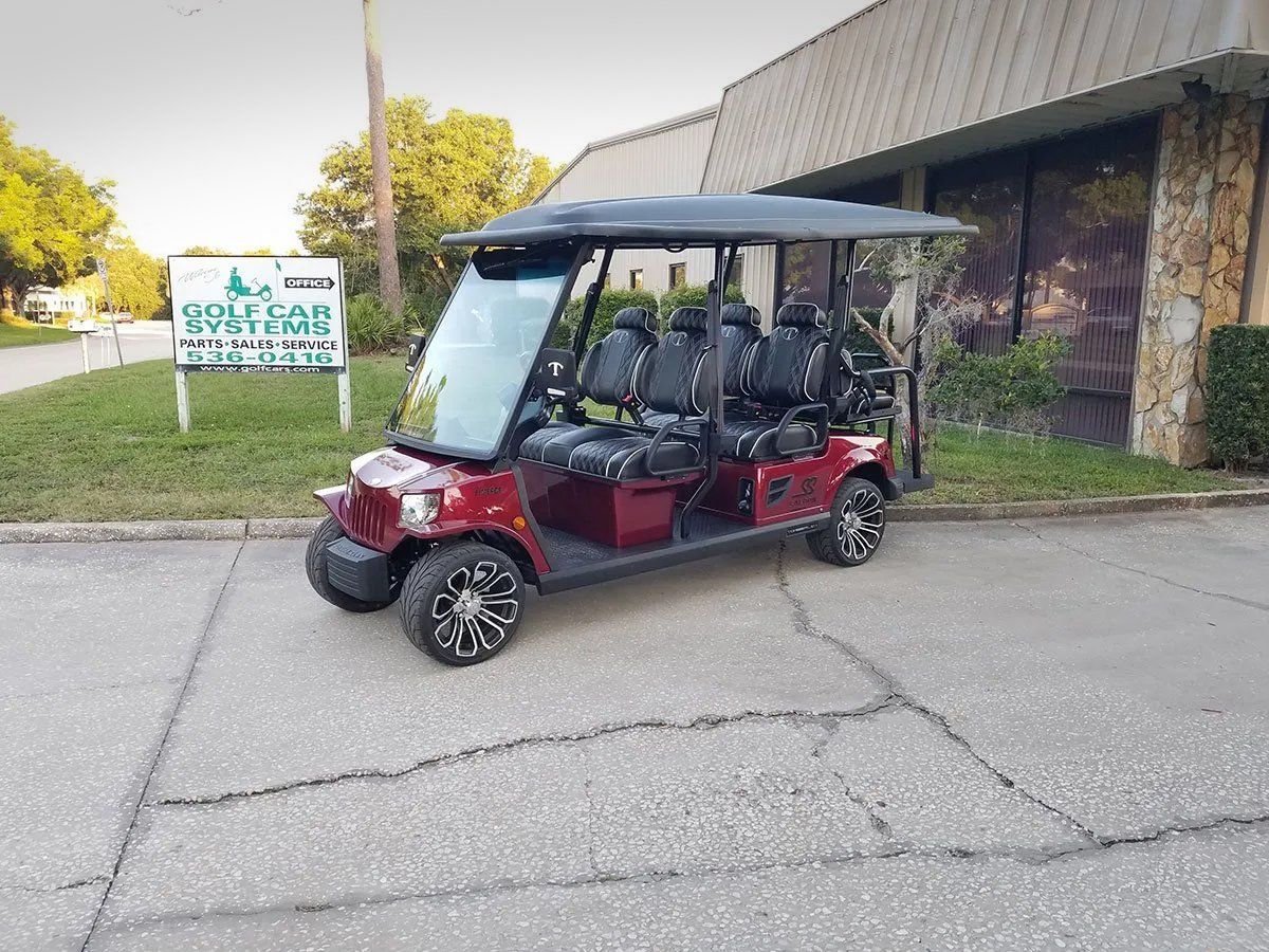 Red Tomberlin golf cart