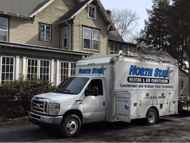 A north star van is parked in front of a house