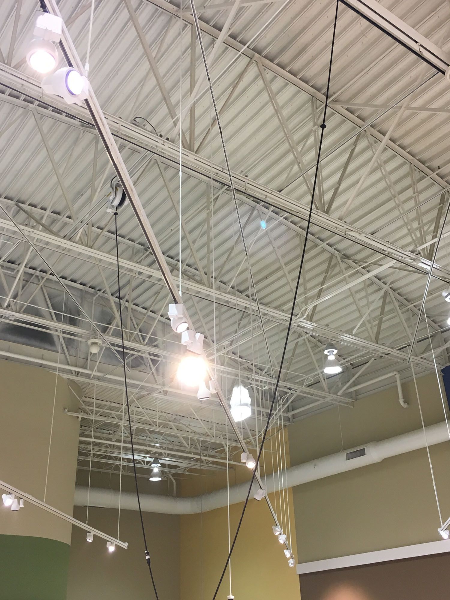 A ceiling with a lot of lights hanging from it