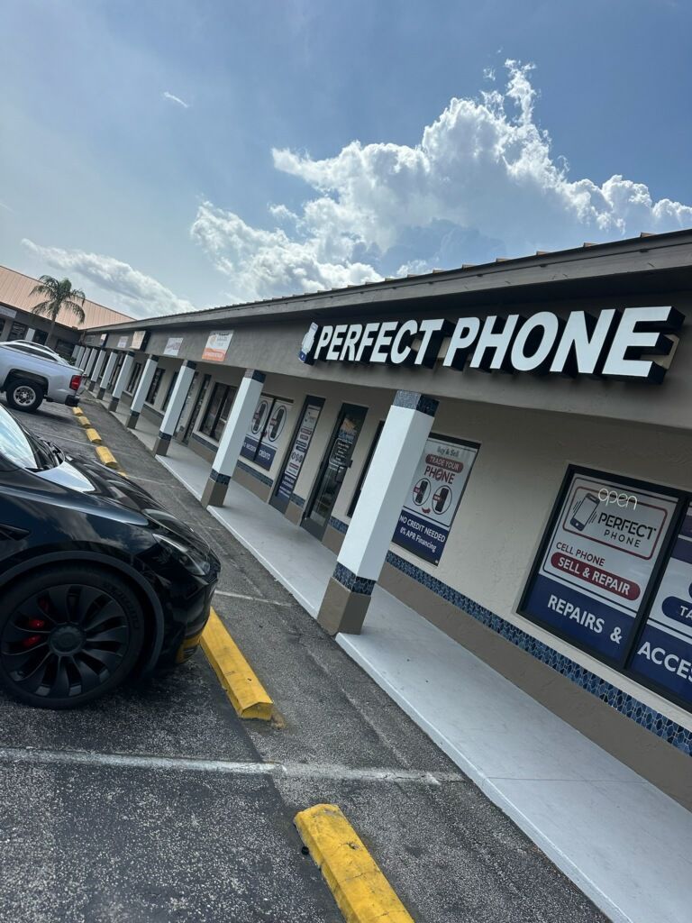Exterior of a shop called Perfect Phone in a strip mall.