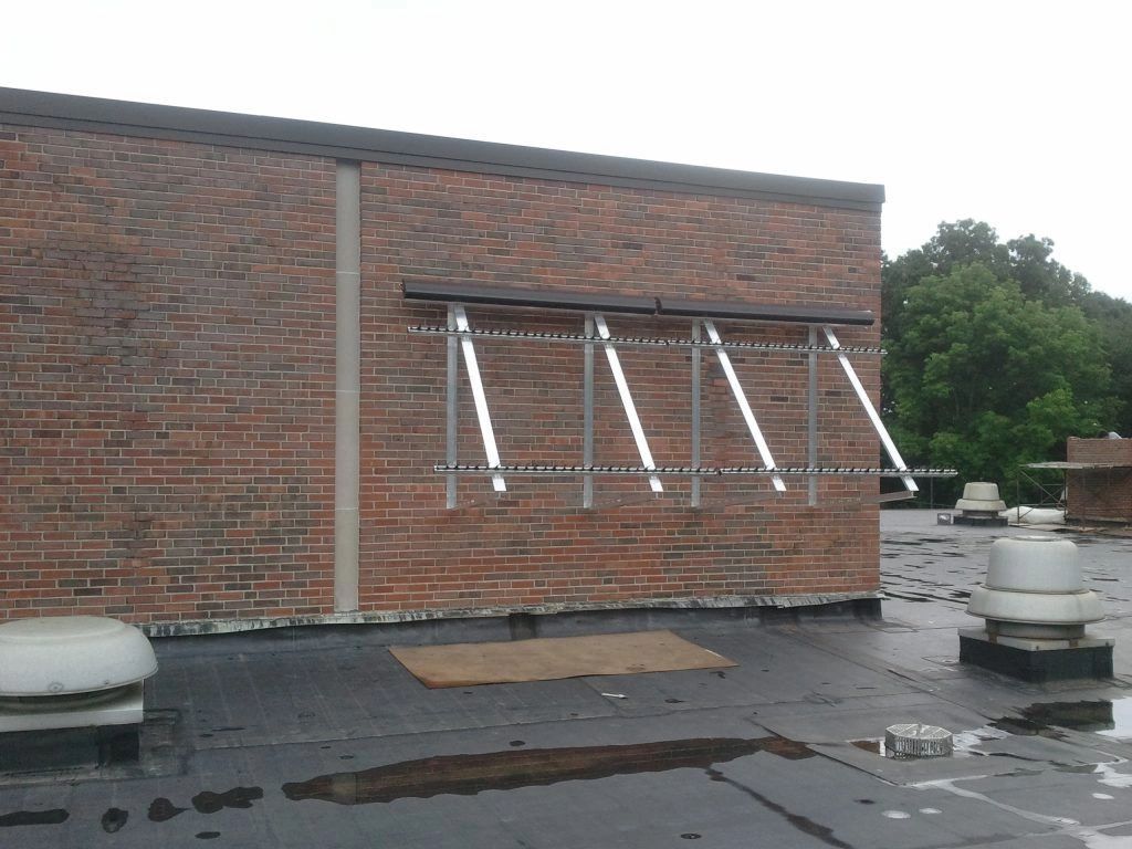 A brick building with a row of windows on the side