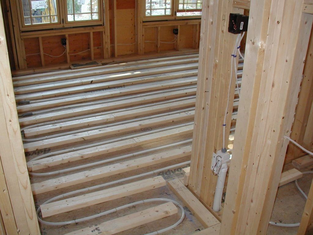 A wooden floor in a house under construction