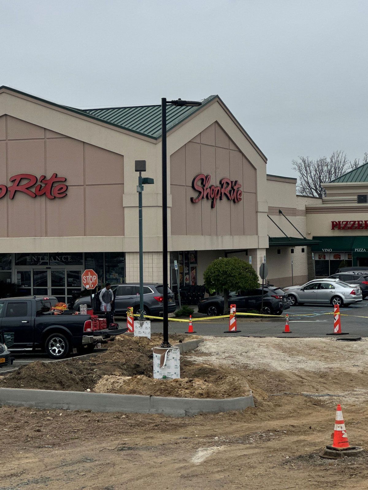A rite aid store with cars parked in front of it