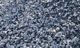 A pile of gravel is sitting on the ground.